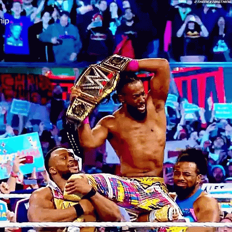 Wrestler Holding Championship Belt GIF