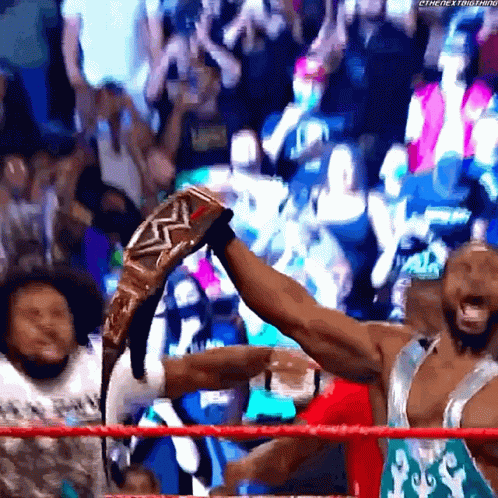 Wrestler Holding Championship Belt GIF