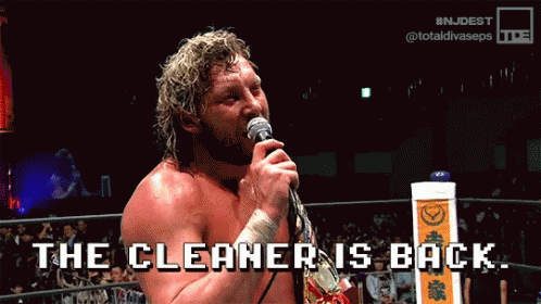 Wrestler Holding Microphone Says The Cleaner Is Back