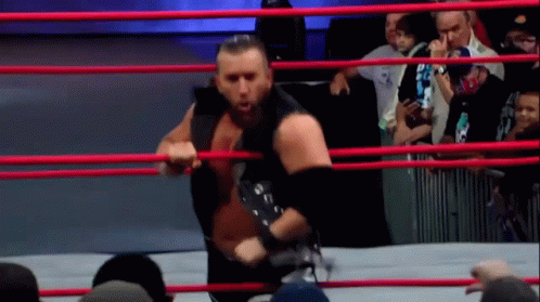 Wrestler Holding Rope In Ring GIF