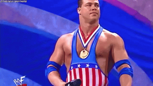 Wrestler In American Flag Outfit With Medal GIF
