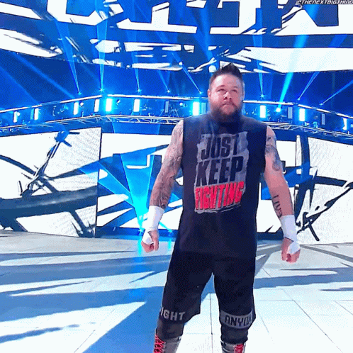 Wrestler in Black Shirt Saying Just Keep Fighting