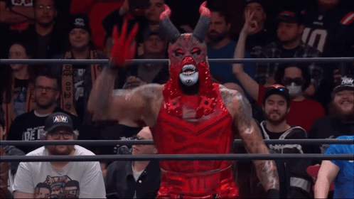 Wrestler in Devil Costume Before Crowd