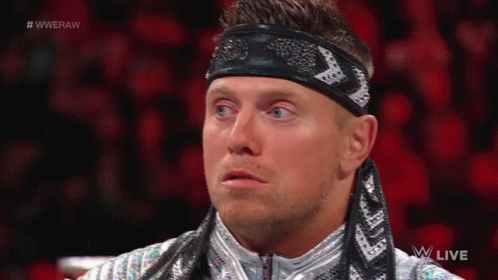 Wrestler in Headband and Silver Jacket