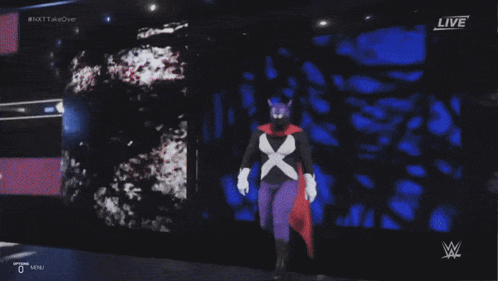 Wrestler In Purple Cape In The Ring GIF