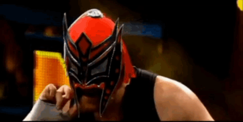 Wrestler in Red and Black Mask Holding Sword
