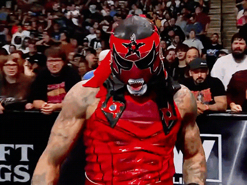 Wrestler in Red Black Mask Crowd GS Sign