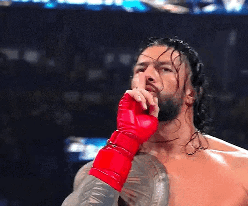 Wrestler in Red Glove Covering Mouth