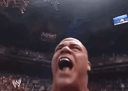 Wrestler In Red Star-Sleeved Jacket Talking Into Microphone GIF