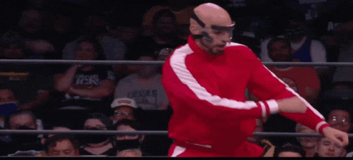 Wrestler in Red Suit Doing Flip