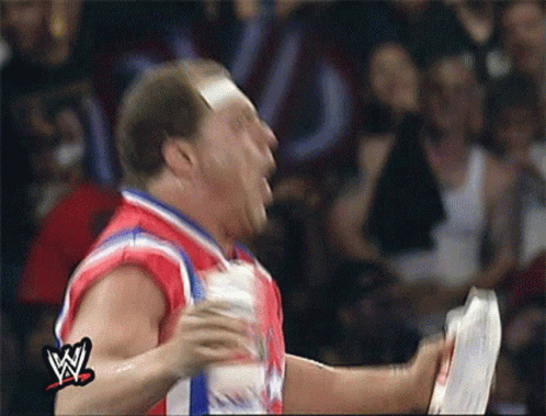 Wrestler in Red White Blue Jersey Holding Paper
