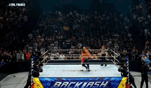 Wrestler in Ring With Backlash Banner