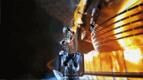 Wrestler In Ring With Fire Background GIF