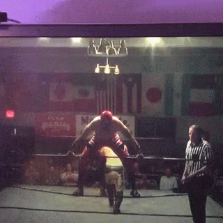 Wrestler In Ring With Referee And Happy Sign GIF