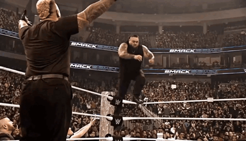 Wrestler In Ring With Smack On Walls GIF
