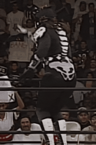Wrestler in Skeleton Costume Jumping
