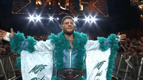 Wrestler in White and Green Outfit Saying NCF