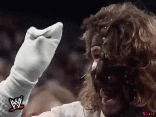 Wrestler in White Gloves and Mask With W Logo
