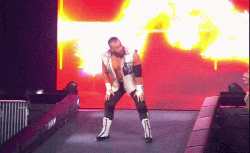 Wrestler in White Vest and Black Pants Dancing