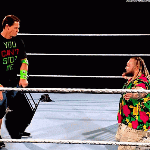 Wrestler in You Can't Stop Me Shirt Talks to Another