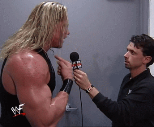 Wrestler Interviewed by Man in WWE Shirt