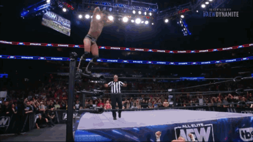 Wrestler Jumping Over Referee In AEW Ring GIF