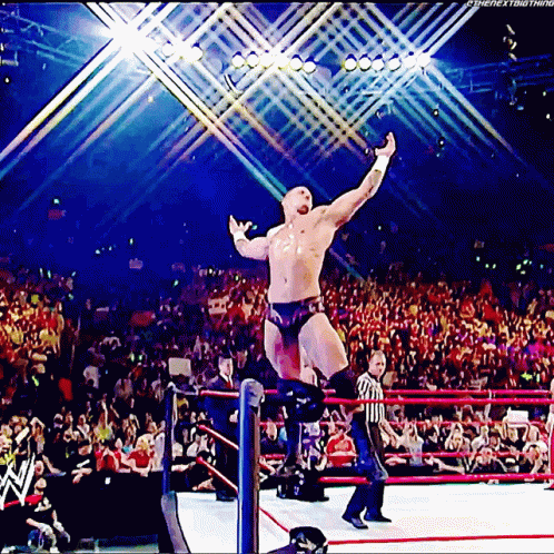 Wrestler Jumping With Referee Watching