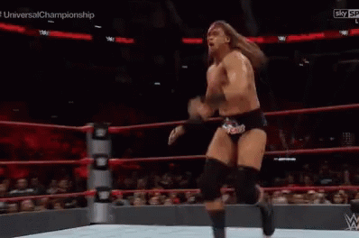 Wrestler Kicking Another Wrestler In Ring GIF