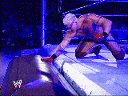 Wrestler Kneeling in Ring