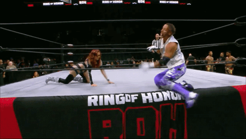 Wrestler Kneeling in Ring of Honor Ring