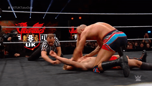 Wrestler Laying in Ring With Pirates UK Logo