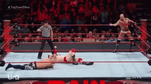 Wrestler Laying in Ring with Referee