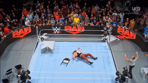 Wrestler Laying on Floor in Raw Ring