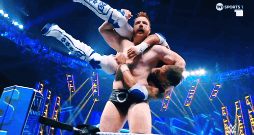 Wrestler Lifted In Air By Another Wrestler TNT Sports Advertisement GIF