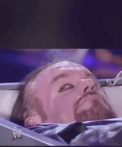 Wrestler Lying on Ring Floor Live