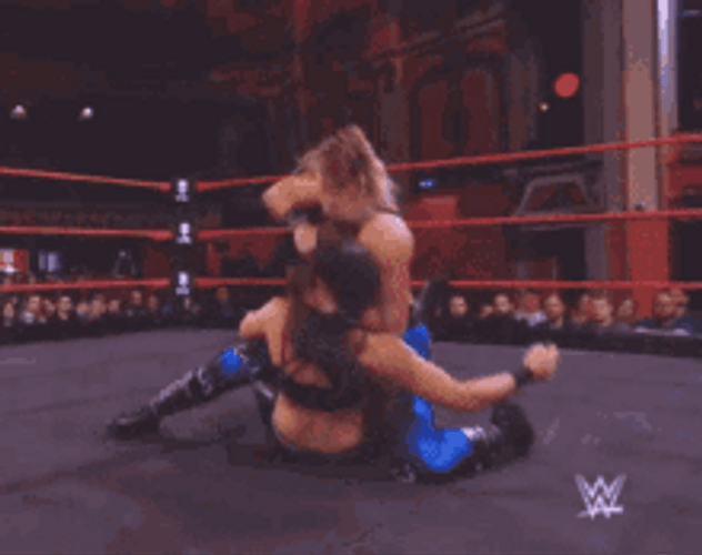 Wrestler Rhea Ripley Punching GIF
