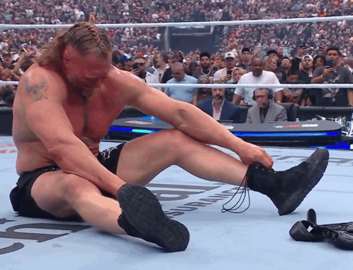 Wrestler Sitting Crossed Legs Crowd Watching