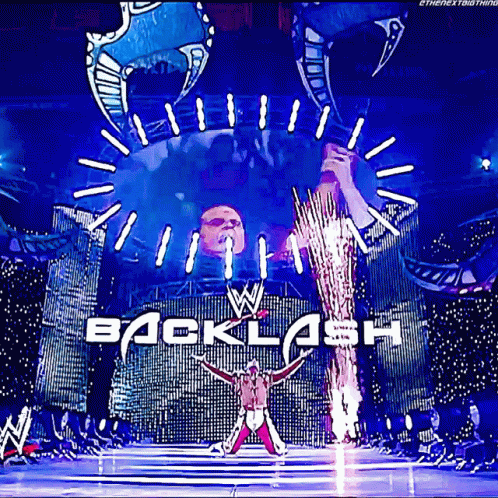 Wrestler Standing Before Backlash Banner