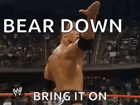 Wrestler Standing In Ring With Arms Up Saying Bear Down Bring It On GIF
