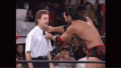 Wrestler Tying Referee's Neck