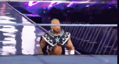 Wrestler Walking Out of Ring With Crowd Watching