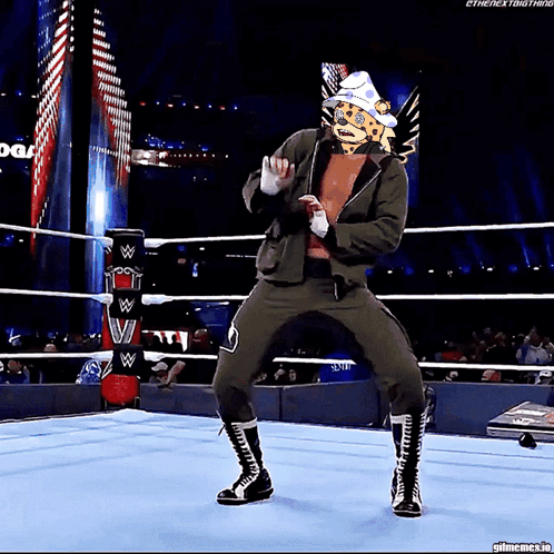 Wrestler With Cheetah Head Dancing in Ring