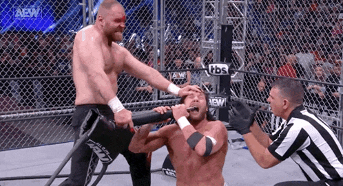 Wrestler With Forehead Bandage Attacked in Cage