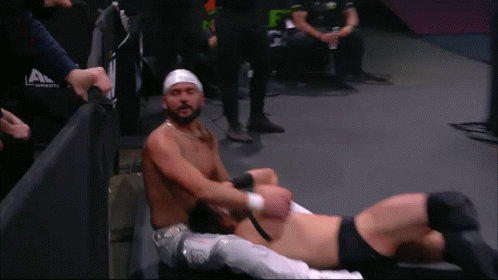Wrestler With Head Bandage Lying With Another