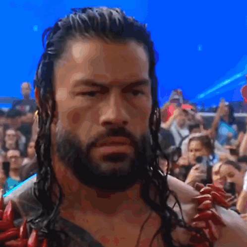 Wrestler with Long Hair and Beard Before Crowd
