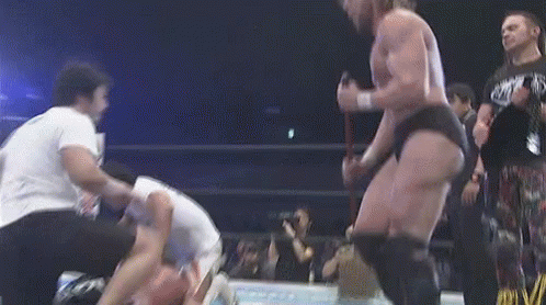 Wrestler With Rope Around Waist in Wrestling Ring