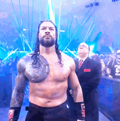 Wrestler With Shield in Front of Crowd and Referee