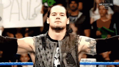 Wrestler With Sign Saying Paul GIF