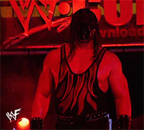 Wrestler With Sign Saying W