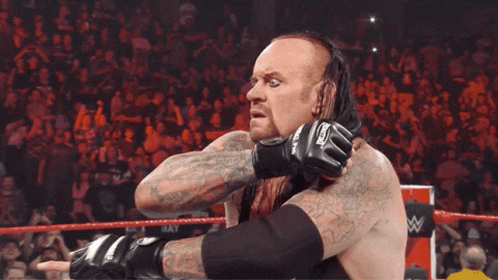 Wrestler with Undertaker Gloves Tongue Out